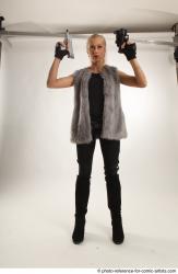 NIKOL STANDING POSE WITH TWO GUNS